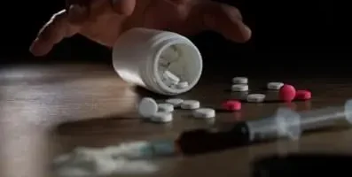 pills scattered on table.