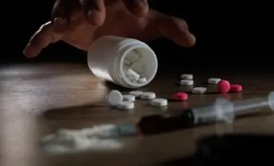 pills scattered on table.