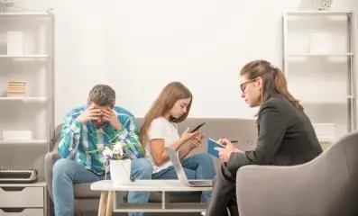Therapist with parent and child.