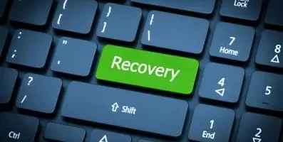 key board with a green key that says recovery.