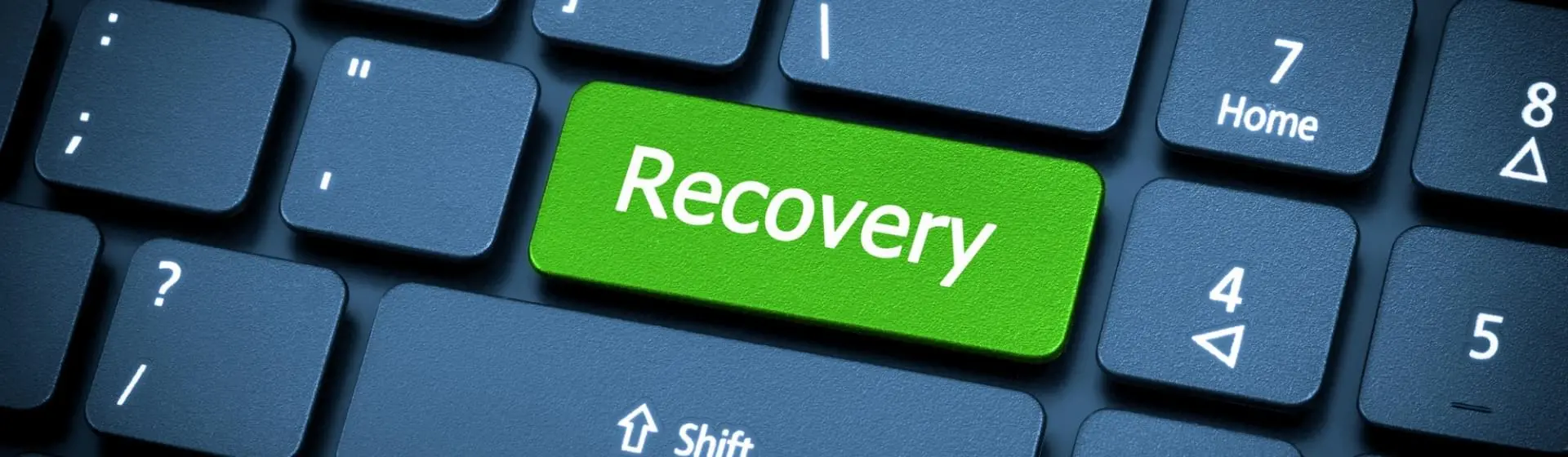 key board with a green key that says recovery.