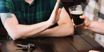 Man refusing alcohol.