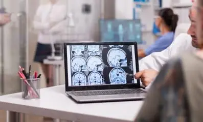 Person looking at brain scans.