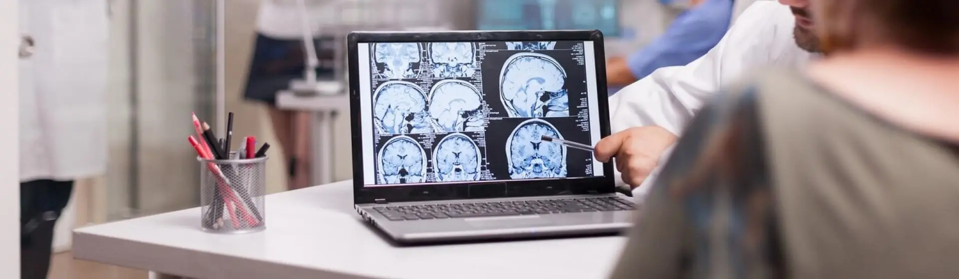 Person looking at brain scans.