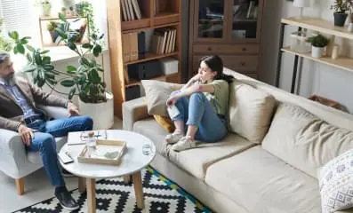 woman speaking to therapist