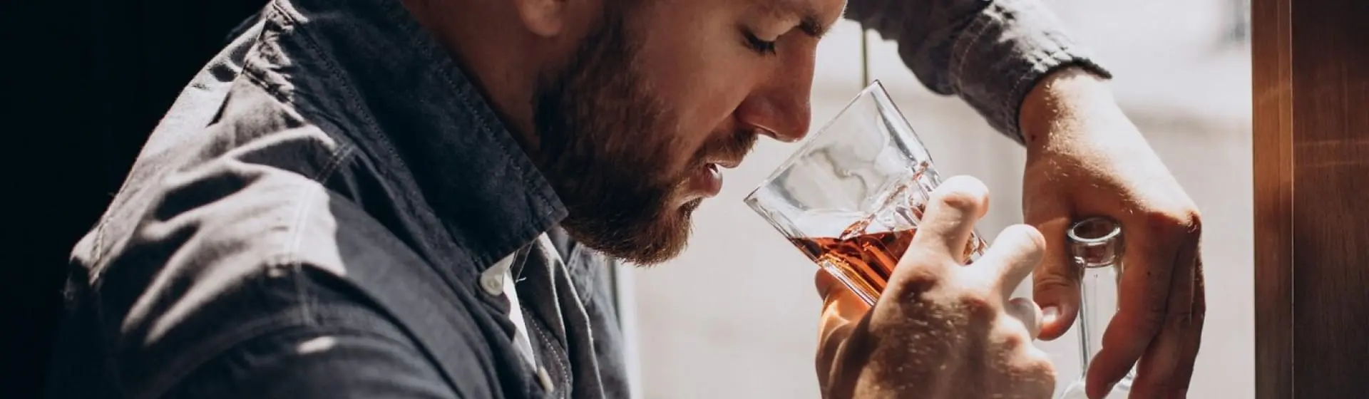 Man drinking alcohol.