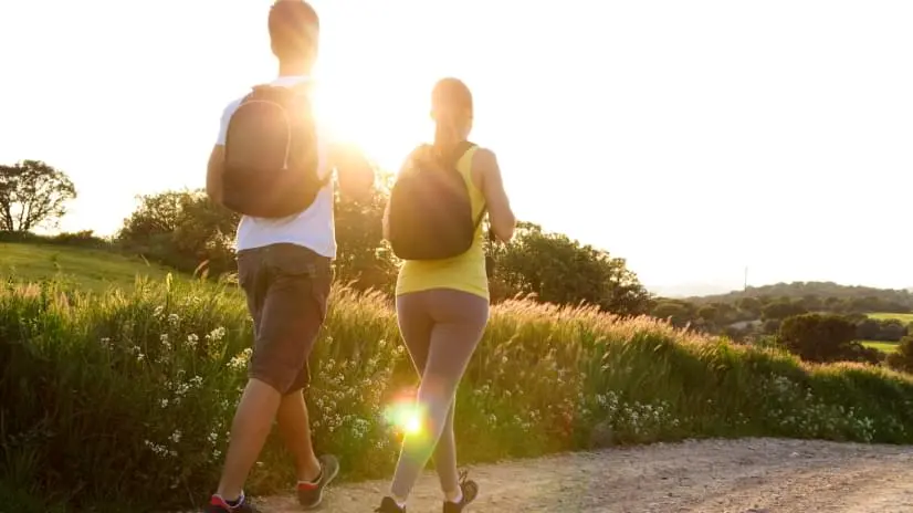 Two people walking together.