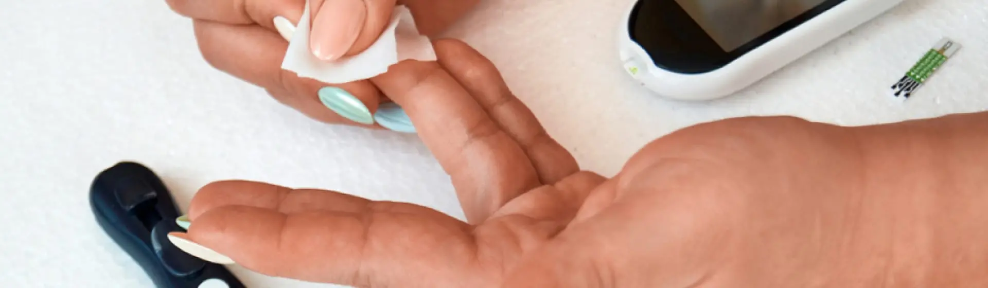 Finger prick test. Text: If you have diabetes, your blood sugar levels may plummet when you are consuming alcohol and taking insulin.