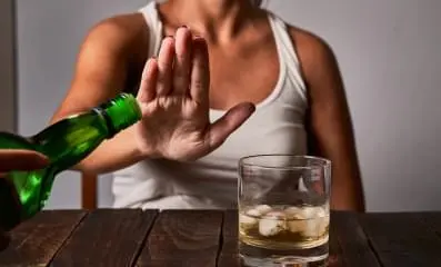 Woman rejecting alcohol