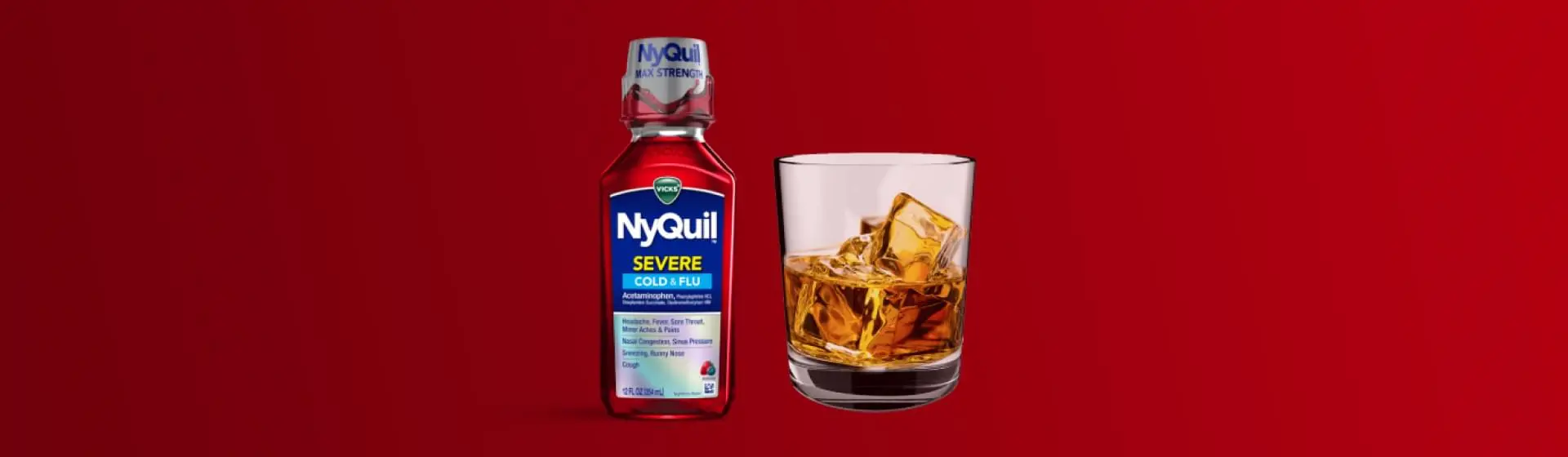 A bottle of Nyquil next to a glass of alcohol.