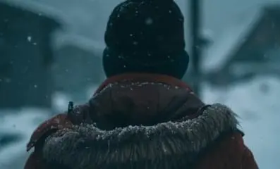 Person staring out in the snow