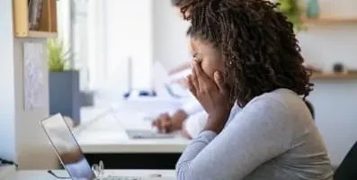 depressed woman Infront of laptop