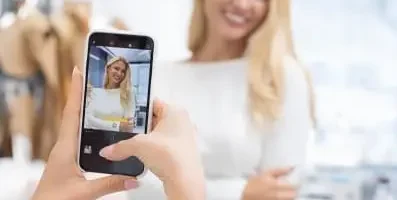 Woman recording a Tik Tok video
