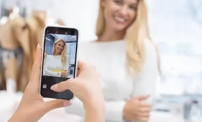 Woman recording a Tik Tok video