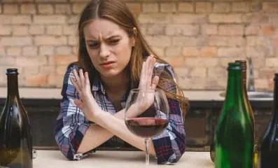 Woman saying no to alcohol.