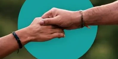 Two people holding hands.