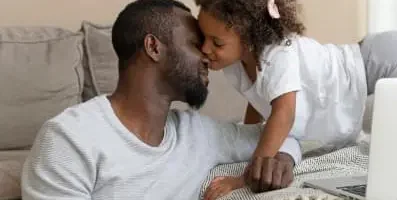 Father and daughter playing together.