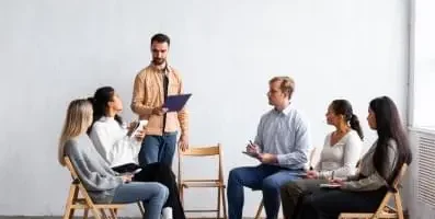 A group of people gathered for therapy.