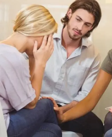 A group of people supporting a friend.