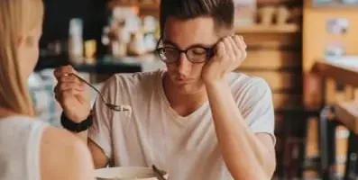A man having dinner not eating his food.