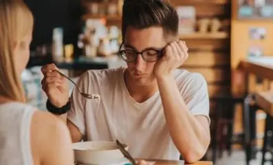 A man having dinner not eating his food.