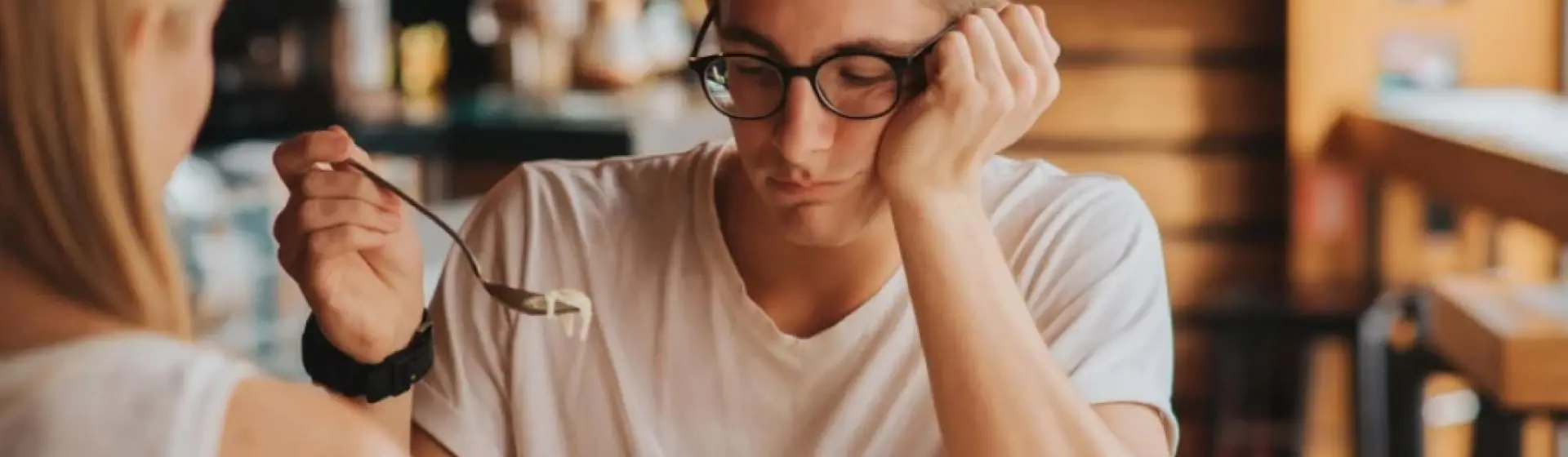 A man having dinner not eating his food.