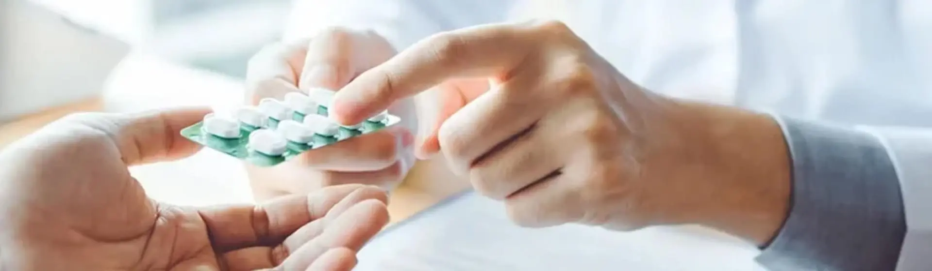 Doctor prescribing pills.