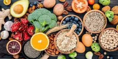 A table with various fruits and vegetables.