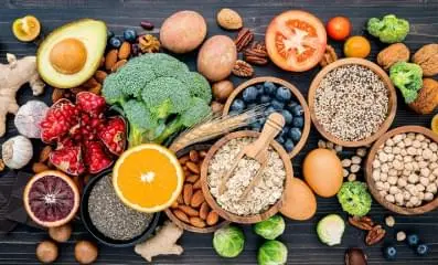 A table with various fruits and vegetables.