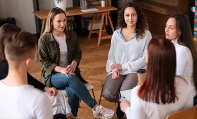 A group of people sitting together.