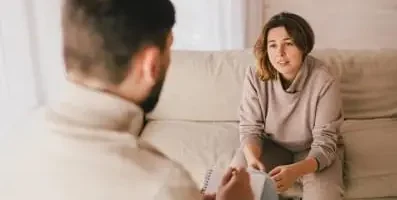 Woman on a therapist’s couch.