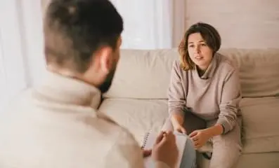 Woman on a therapist’s couch.