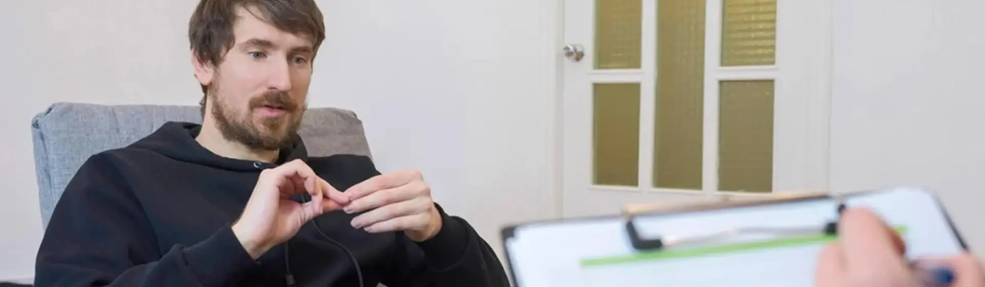 Man speaking with a therapist.