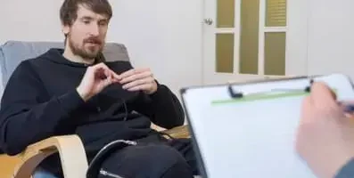 Man speaking with a therapist.