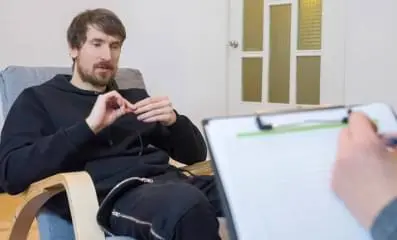 Man speaking with a therapist.