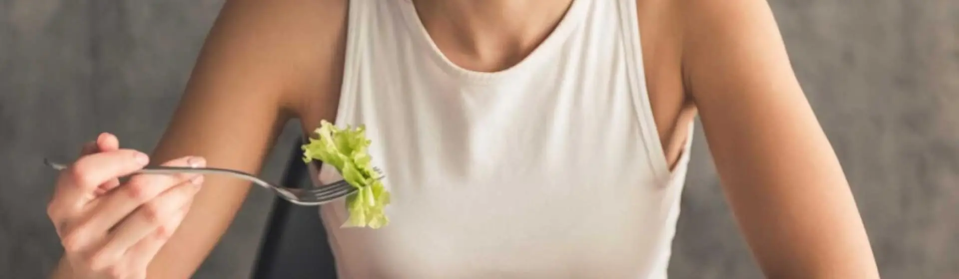 Woman eating a salad.