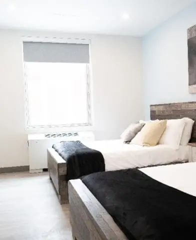 Image: Bedroom at Indiana Center for Recovery. Text: Detox centers ensure the safe removal of harmful substances under medical supervision
