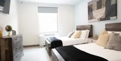 Image: Bedroom at Indiana Center for Recovery. Text: Detox centers ensure the safe removal of harmful substances under medical supervision