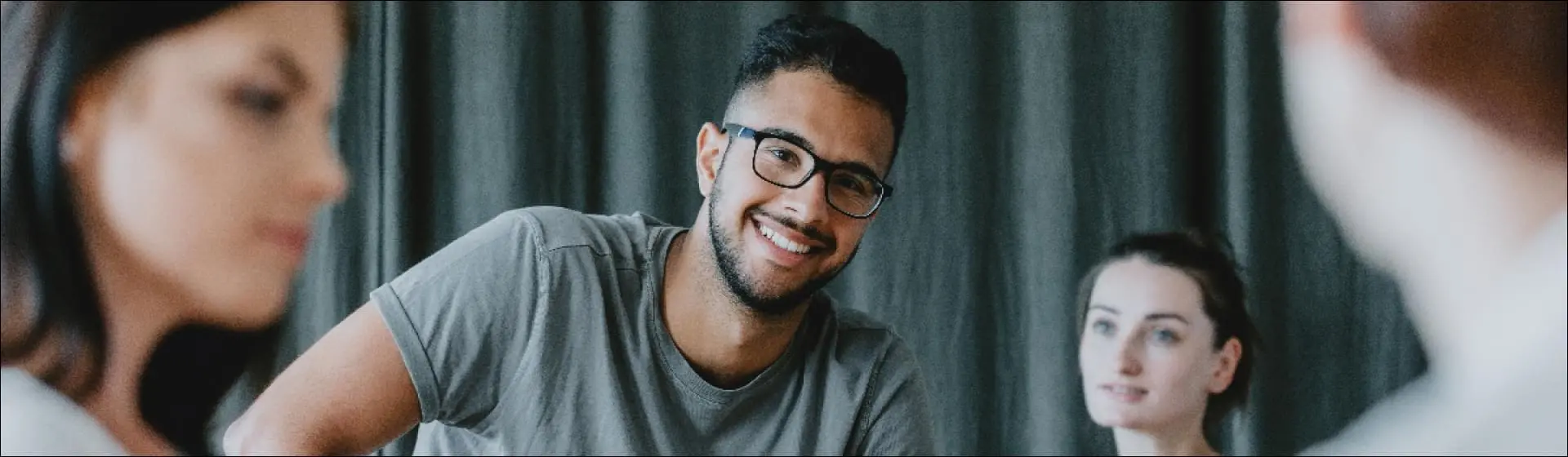 Smiling man in gray shirt. Text: Look for treatment providers who specialize in addressing both drug addiction and mental health disorders.