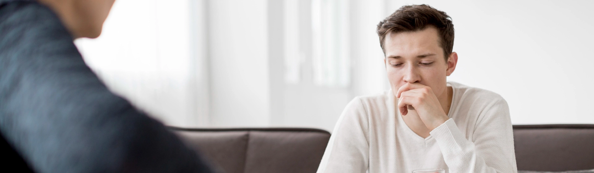 Image of a diverse group in a circle with a counselor, symbolizing professional mental health support, with the text 'Seeking Professional Help: Guidance and Support