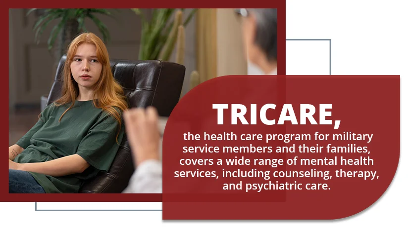 A therapist takes notes while listening to a military service member in uniform during counseling.