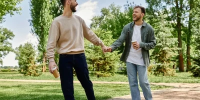two guys holding hands