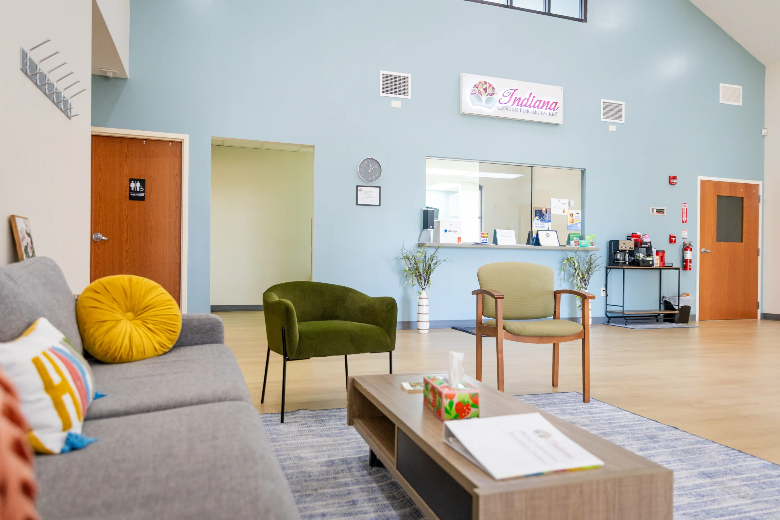 Reception and waiting area at Indiana Center for Recovery Terre Haute, featuring modern furniture, welcoming atmosphere, and comfortable seating for clients.