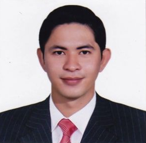 A formal portrait of a man wearing a suit and tie