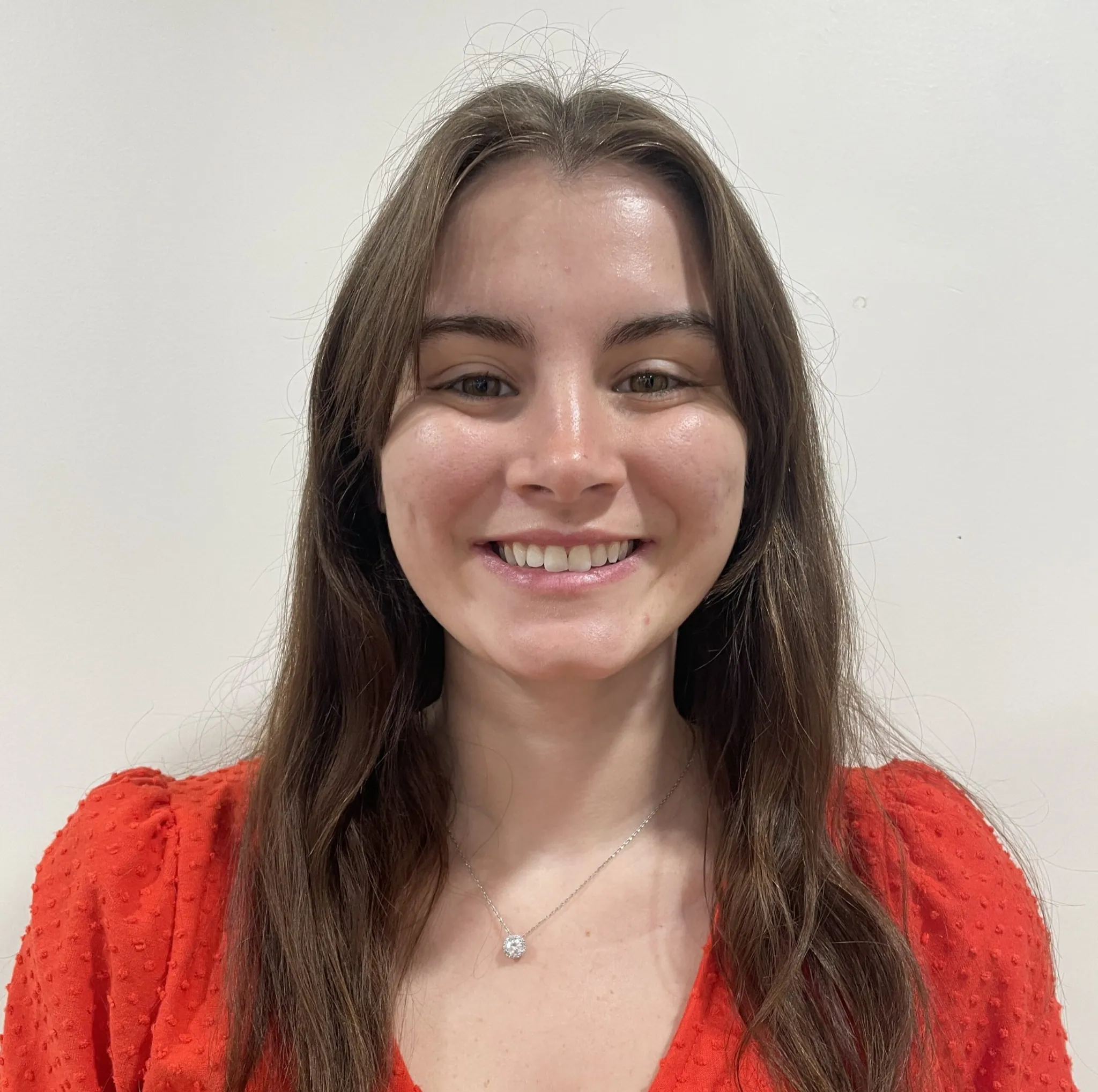 Mackenzi Neeley, Indiana Center for Recovery team member headshot in red blouse